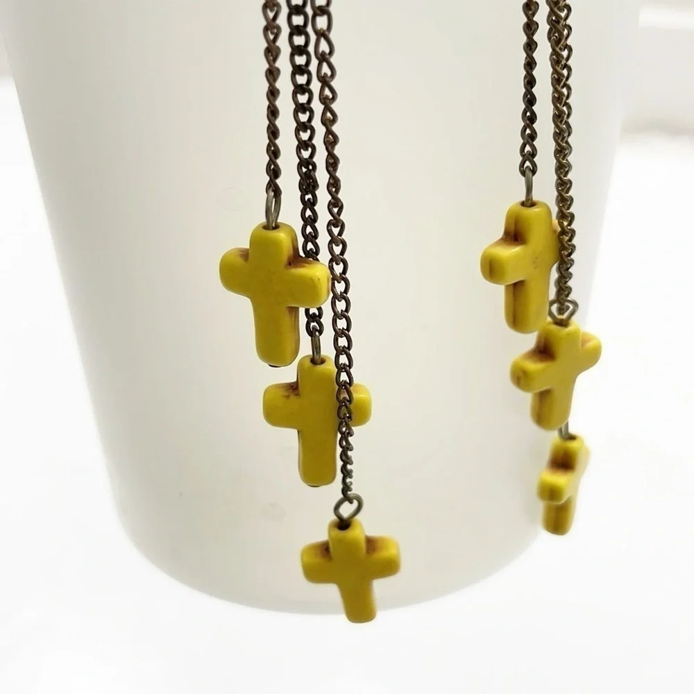 Yellow hanging cross earrings